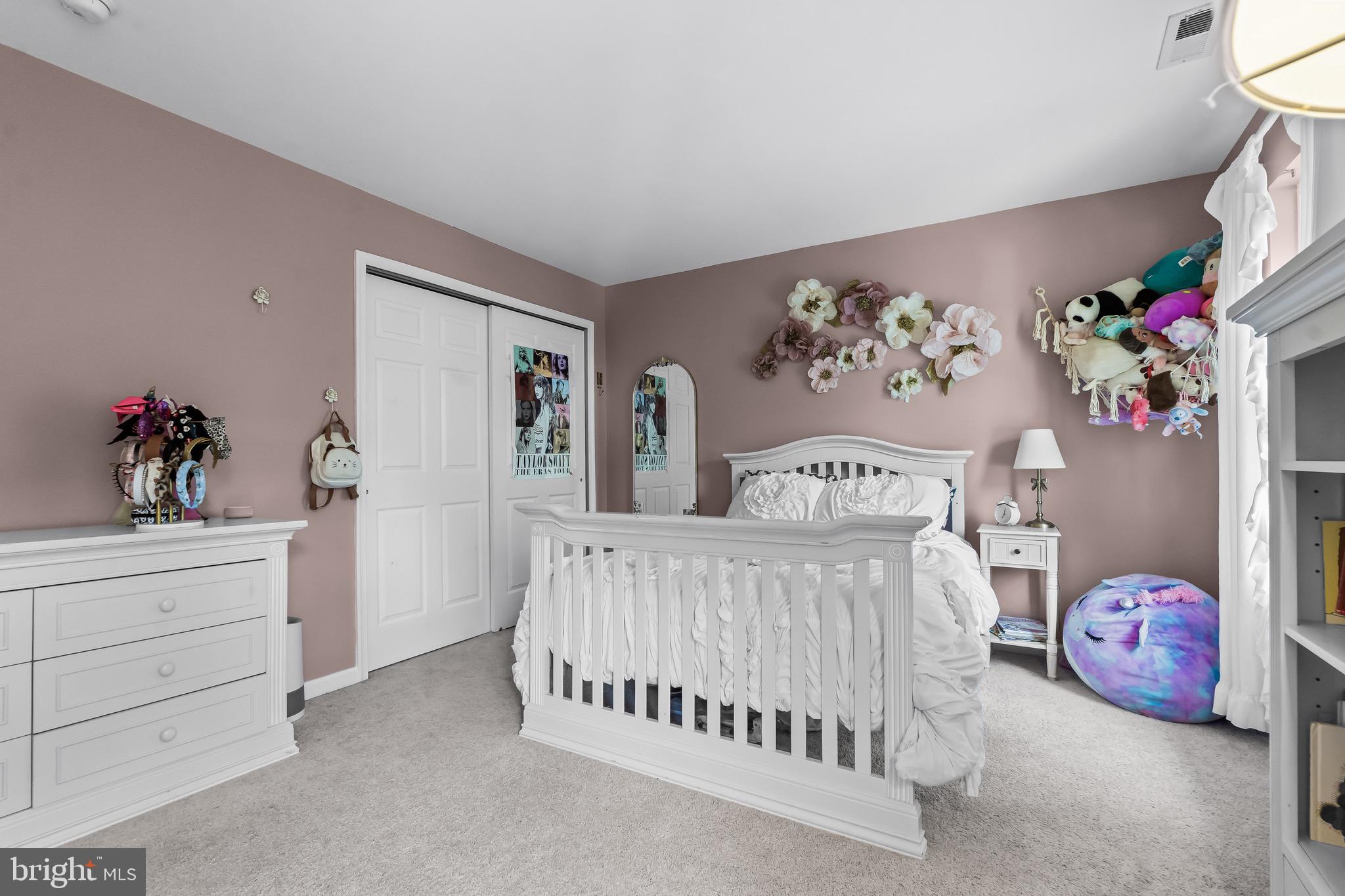 3653 Tuckahoe Road Franklinville, NJ 08322 - Photo 24 of 41 a bedroom with a bed and a chandelier