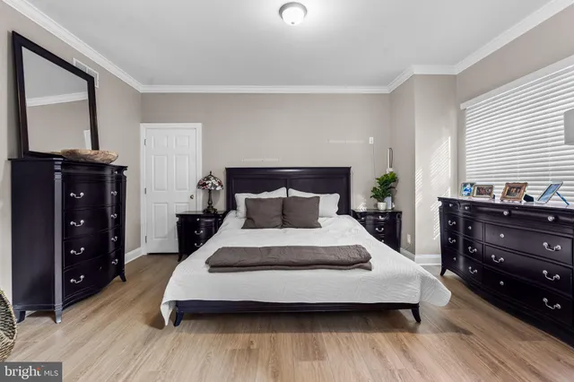 a bedroom with a bed and a mirror