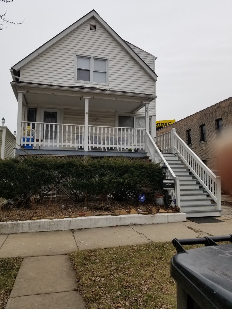 4019 North Tripp Avenue Chicago, IL 60641 - Photo 2 of 31 a front view of a house with a yard