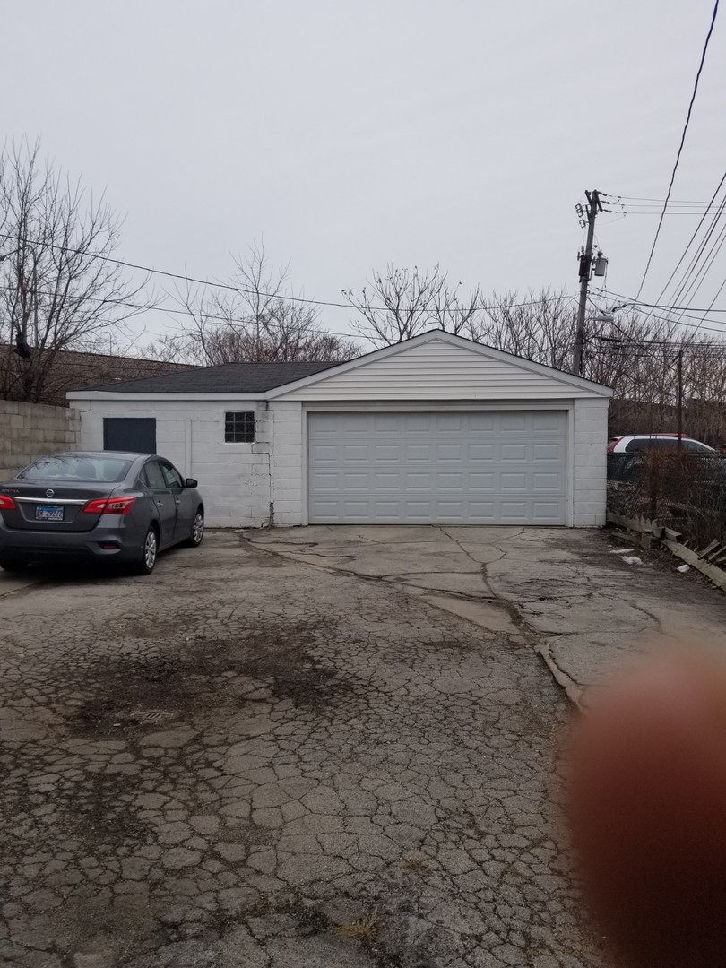 4019 North Tripp Avenue Chicago, IL 60641 - Photo 3 of 31 a couple of cars parked in front of a house