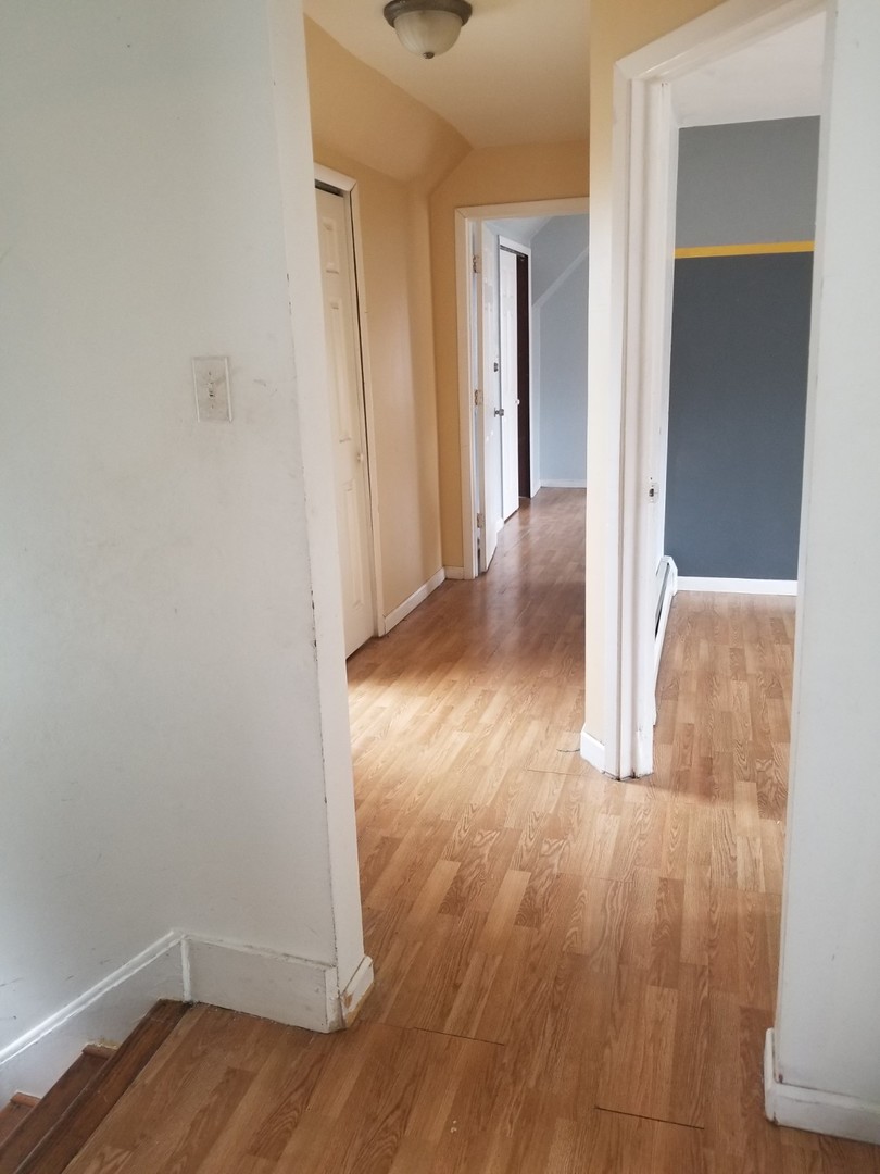 4019 North Tripp Avenue Chicago, IL 60641 - Photo 22 of 31 a view of a room with wooden floor