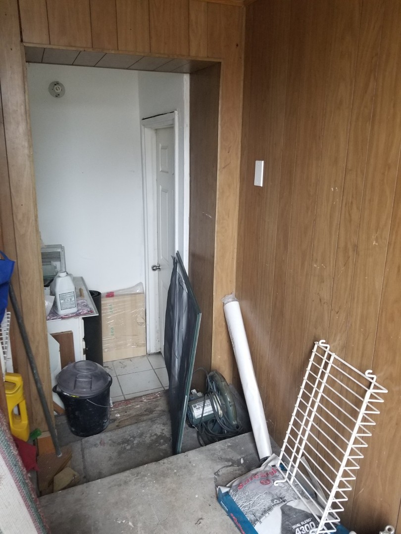 4019 North Tripp Avenue Chicago, IL 60641 - Photo 25 of 31 a living room with furniture and a wooden floor