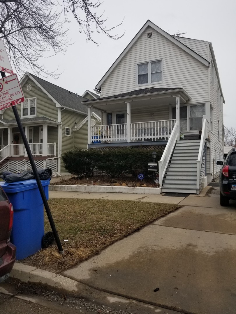 4019 North Tripp Avenue Chicago, IL 60641 - Photo 27 of 31 a front view of a house with a yard