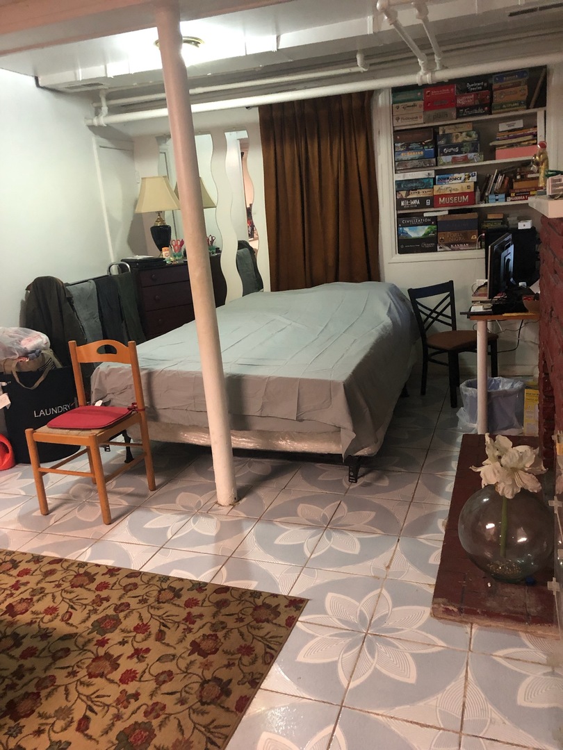 4019 North Tripp Avenue Chicago, IL 60641 - Photo 28 of 31 a bedroom with furniture and a rug