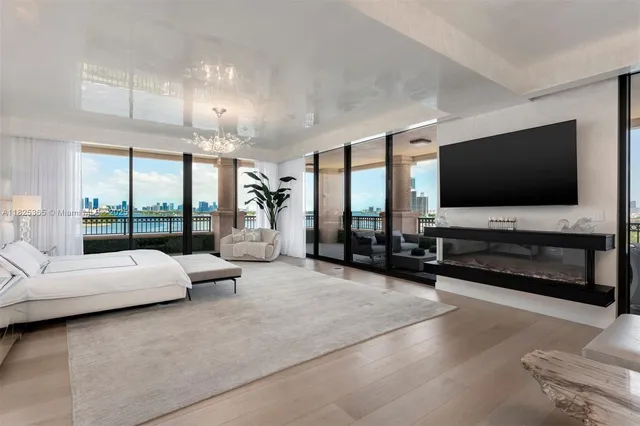 a kitchen with stainless steel appliances granite countertop a stove a sink dishwasher and cabinets with wooden floor