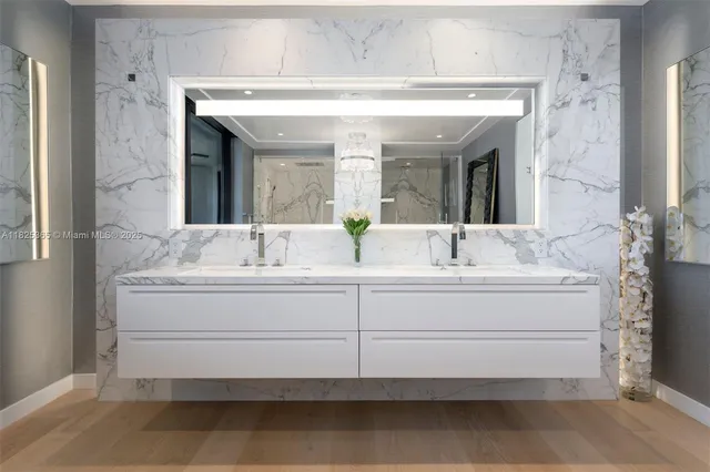 a bedroom with two beds and a large window