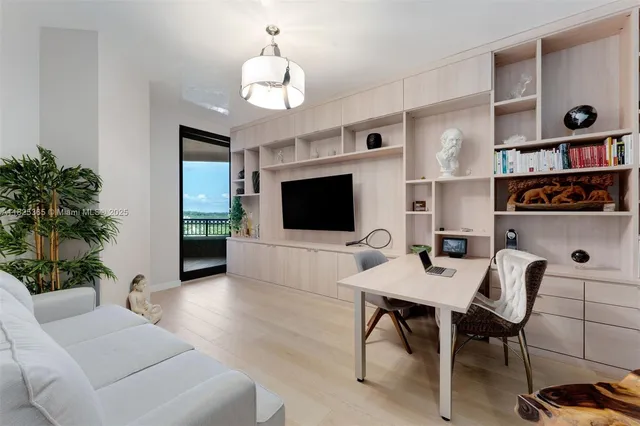 a view of a terrace with couches and wooden floor