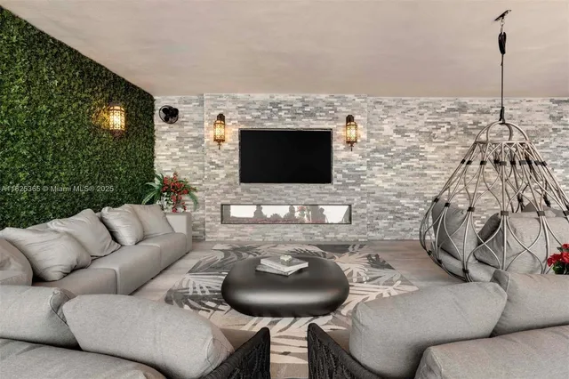 a living room with furniture and a potted plant