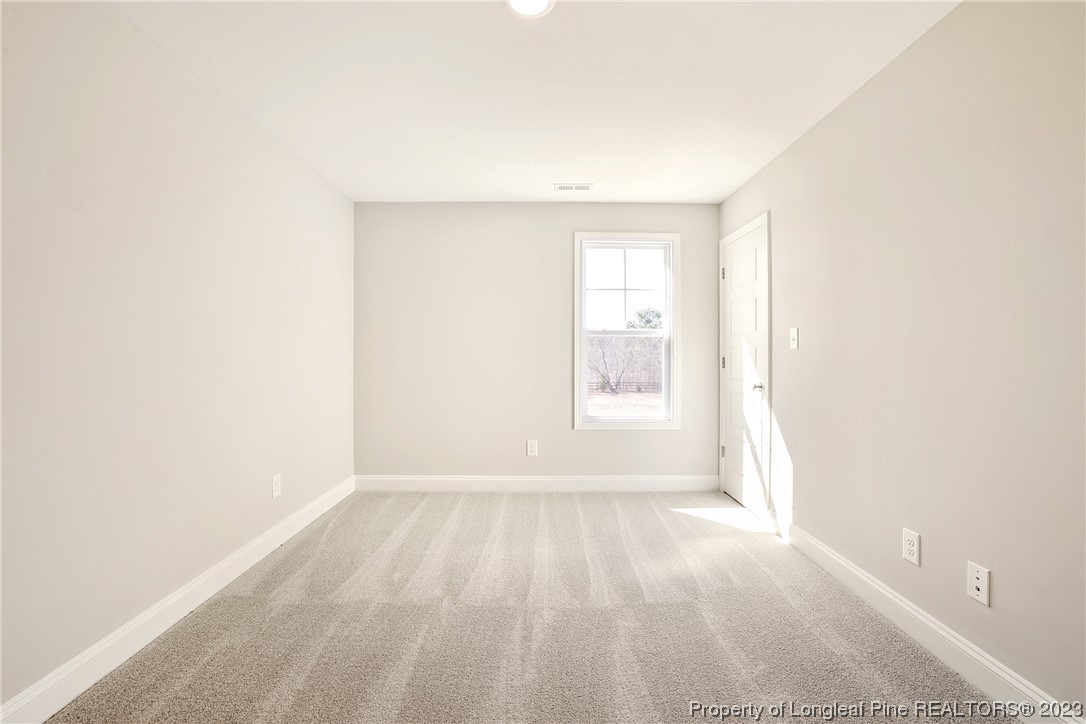 5326 Pittman Grove Church Road Raeford, NC 28376 - Photo 16 of 34 a view of an empty room and a window