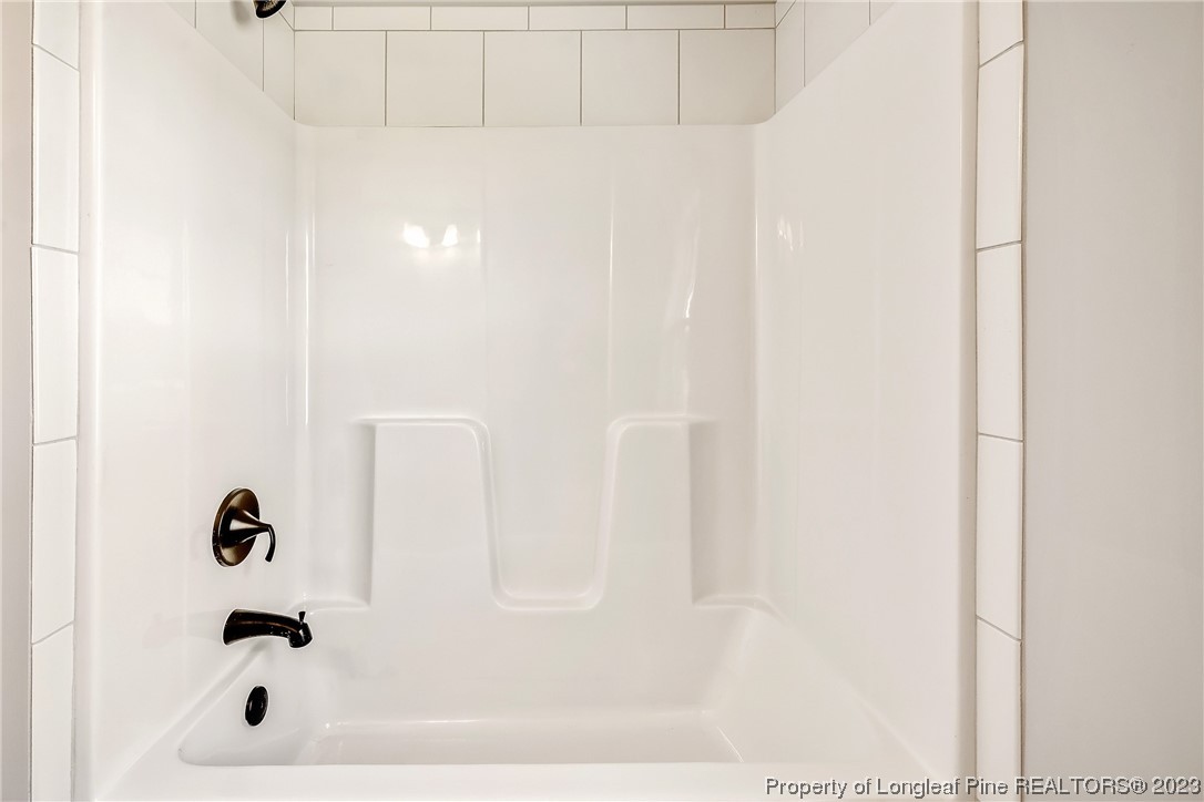 5326 Pittman Grove Church Road Raeford, NC 28376 - Photo 19 of 34 a bathroom with a bathtub