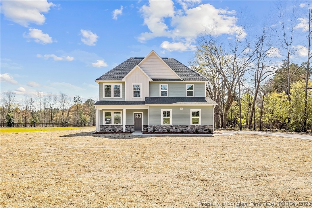5326 Pittman Grove Church Road Raeford, NC 28376 - Photo 2 of 34 a front view of a house with a yard
