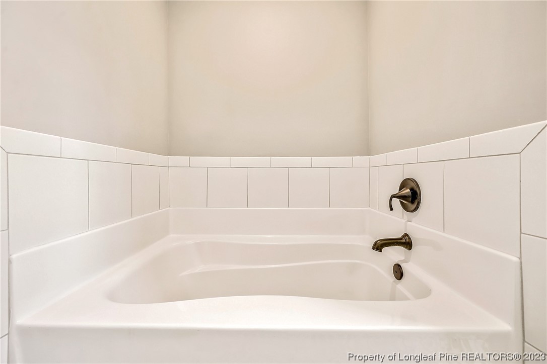 5326 Pittman Grove Church Road Raeford, NC 28376 - Photo 29 of 34 a bathroom with bathtub