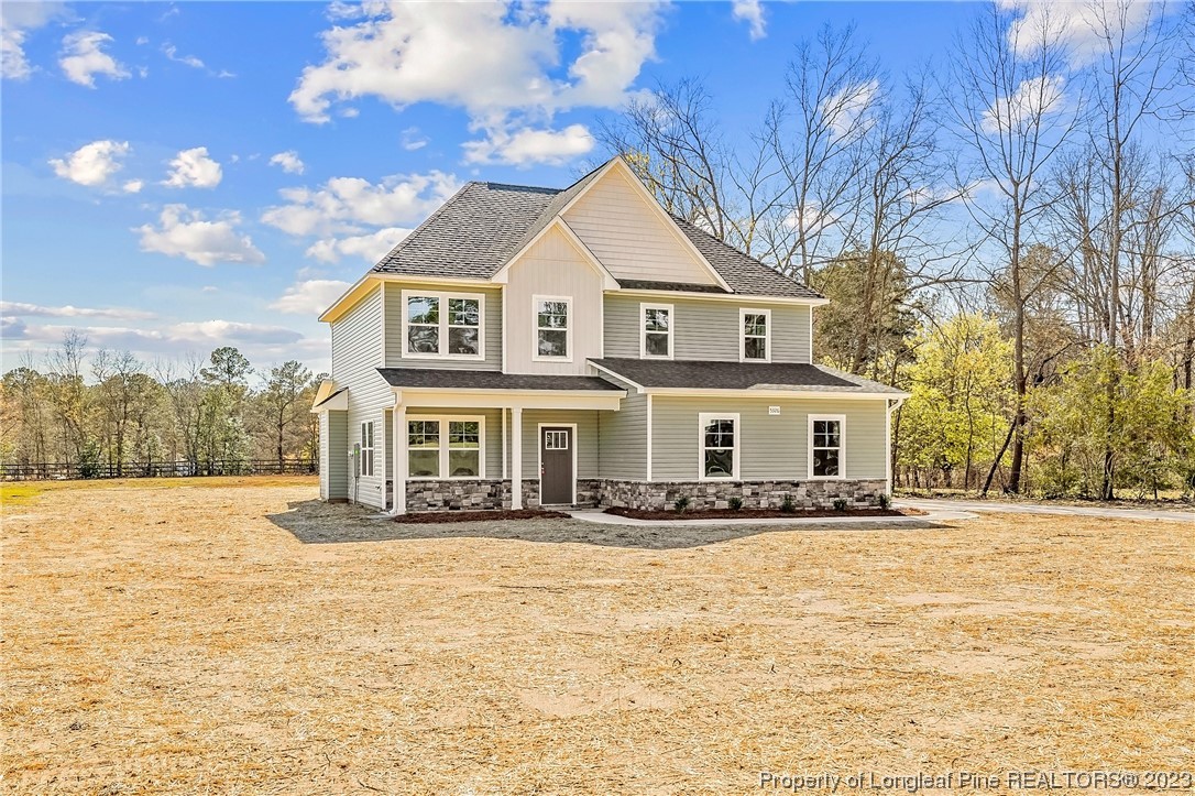 5326 Pittman Grove Church Road Raeford, NC 28376 - Photo 3 of 34 a front view of a house with a yard