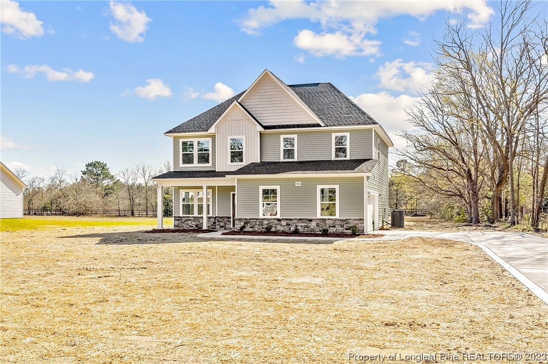 5326 Pittman Grove Church Road Raeford, NC 28376 - Photo 4 of 34 a front view of a house with a yard