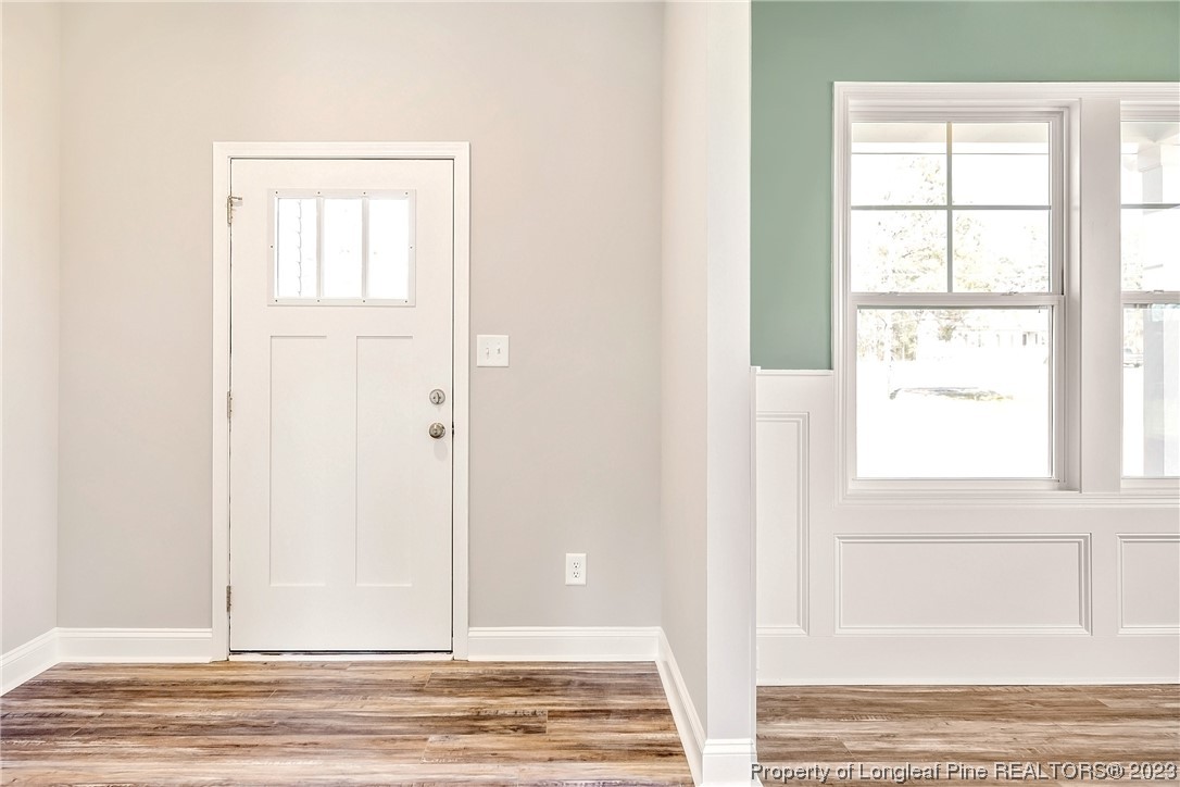 5326 Pittman Grove Church Road Raeford, NC 28376 - Photo 5 of 34 a view of a livingroom with wooden floor and a window