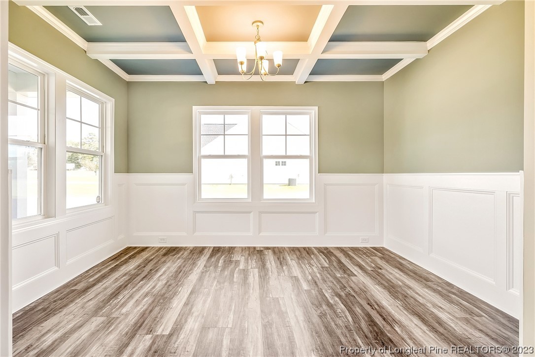 5326 Pittman Grove Church Road Raeford, NC 28376 - Photo 6 of 34 a view of empty room with wooden floor and fan