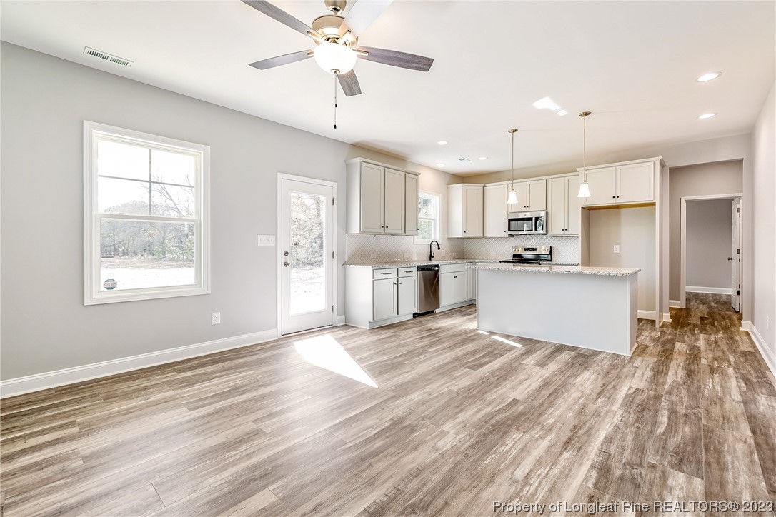 5326 Pittman Grove Church Road Raeford, NC 28376 - Photo 9 of 34 a view of kitchen with cabinets appliances and a window