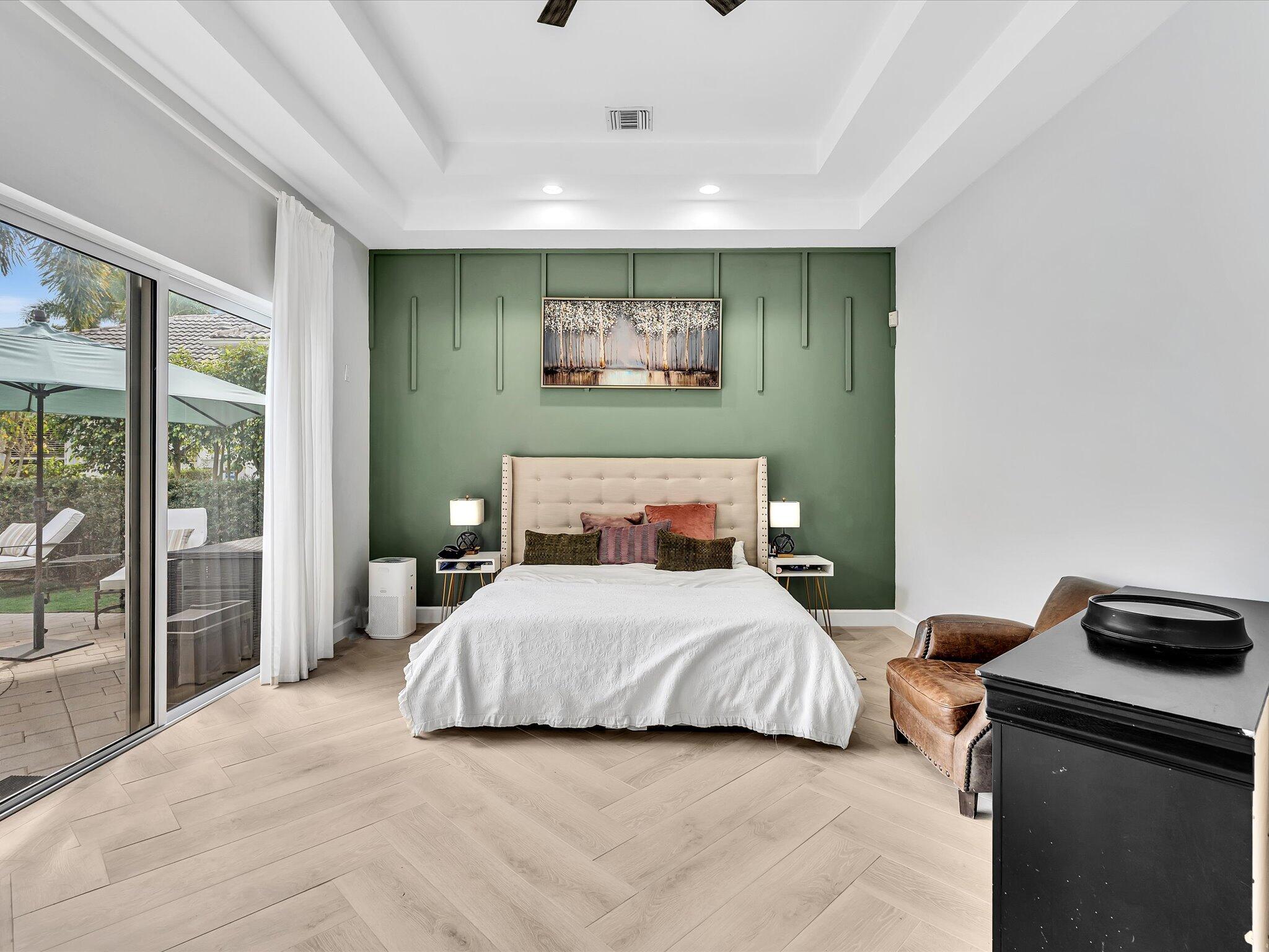 6485 Northwest 32nd Way Boca Raton, FL 33496 - Photo 25 of 54 a bedroom with a bed and a large window