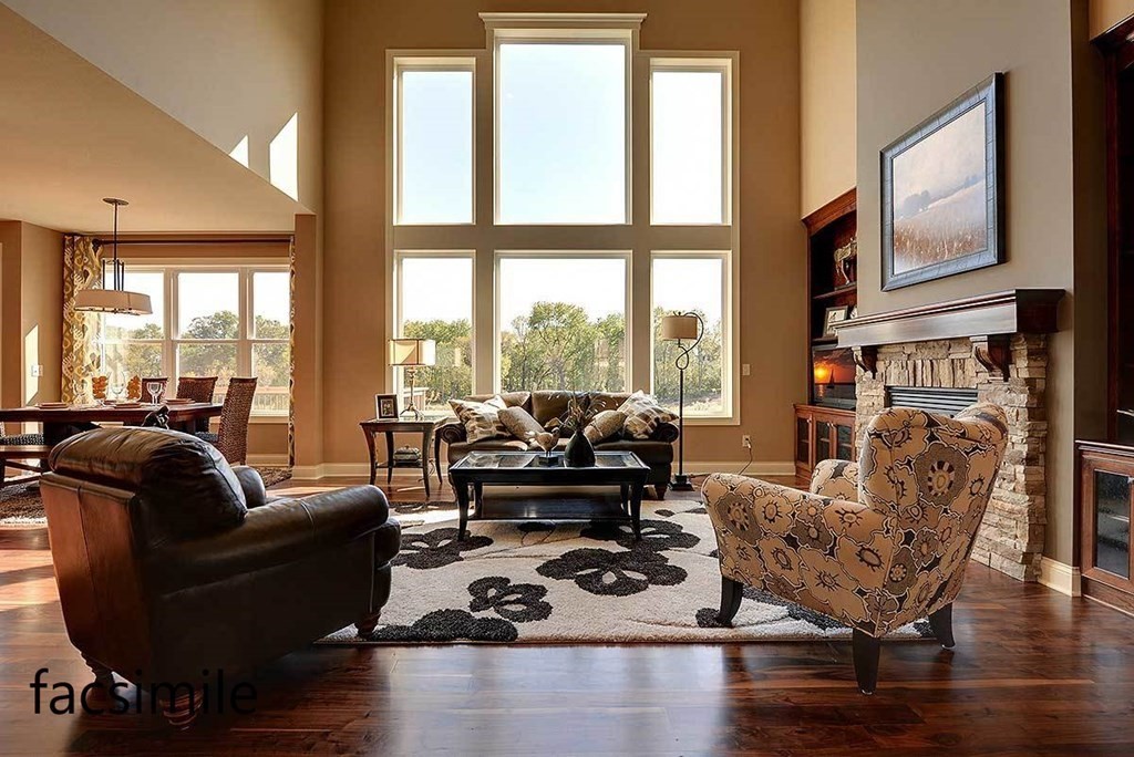 31 Burnham Road Windham, NH 03087 - Photo 7 of 27 a living room with furniture large windows and a fireplace