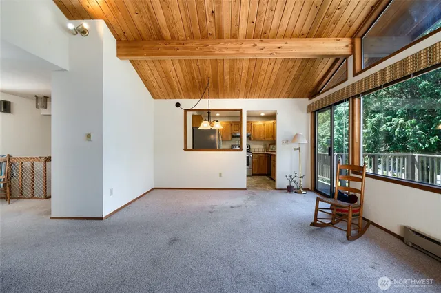 a view of a room with gym equipment and a large window