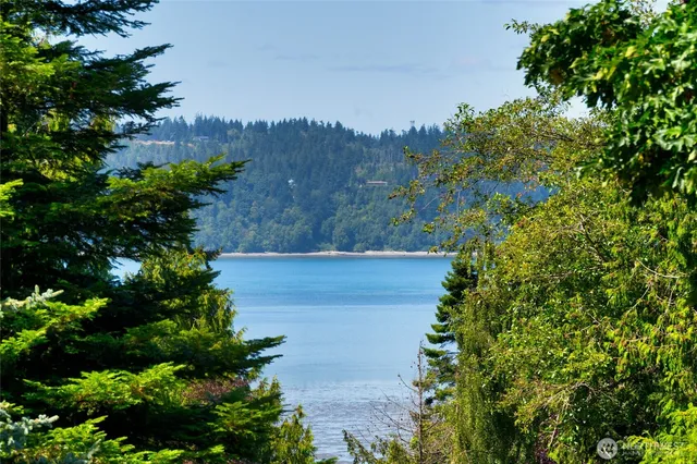 a view of a deck with furniture and garden