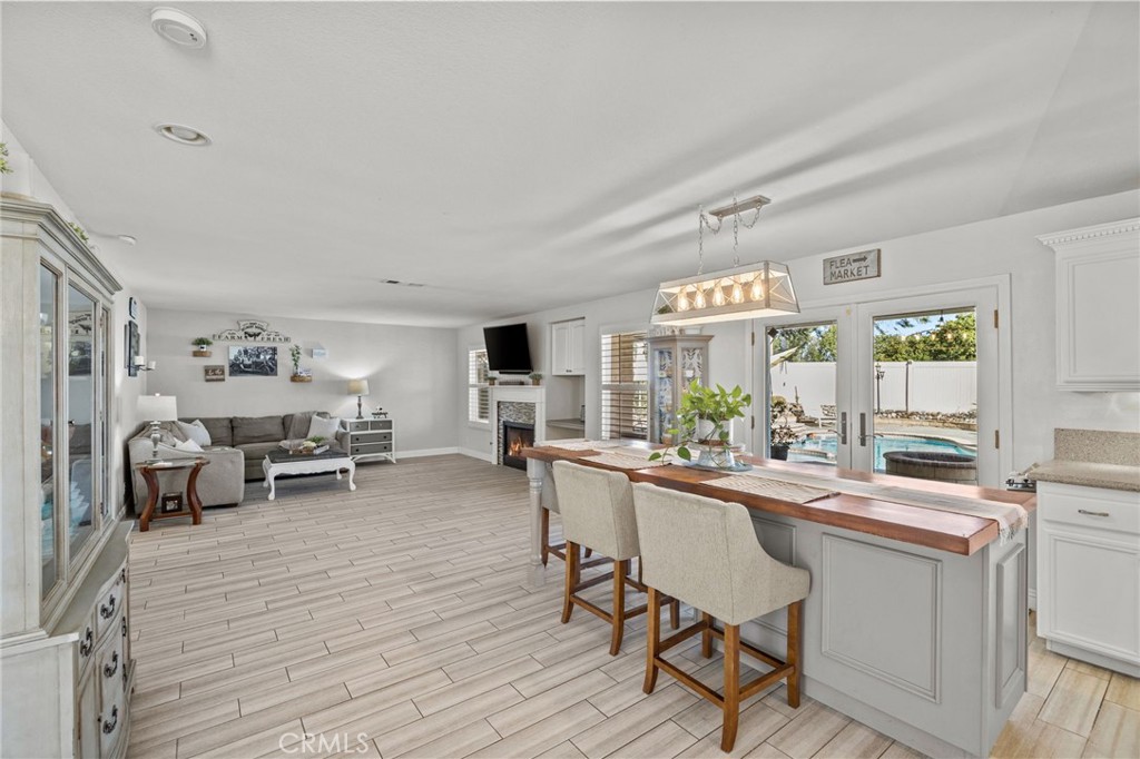 8992 Dahlia Drive Corona, CA 92883 - Photo 11 of 38 a view of a dining room with furniture window and wooden floor