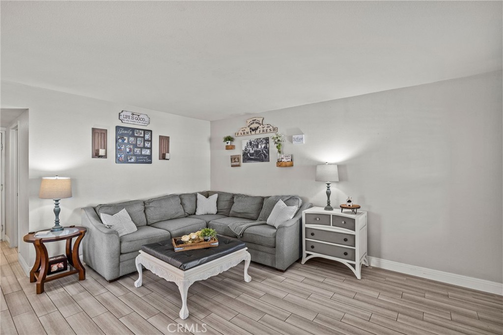 8992 Dahlia Drive Corona, CA 92883 - Photo 14 of 38 a living room with furniture and a wooden floor