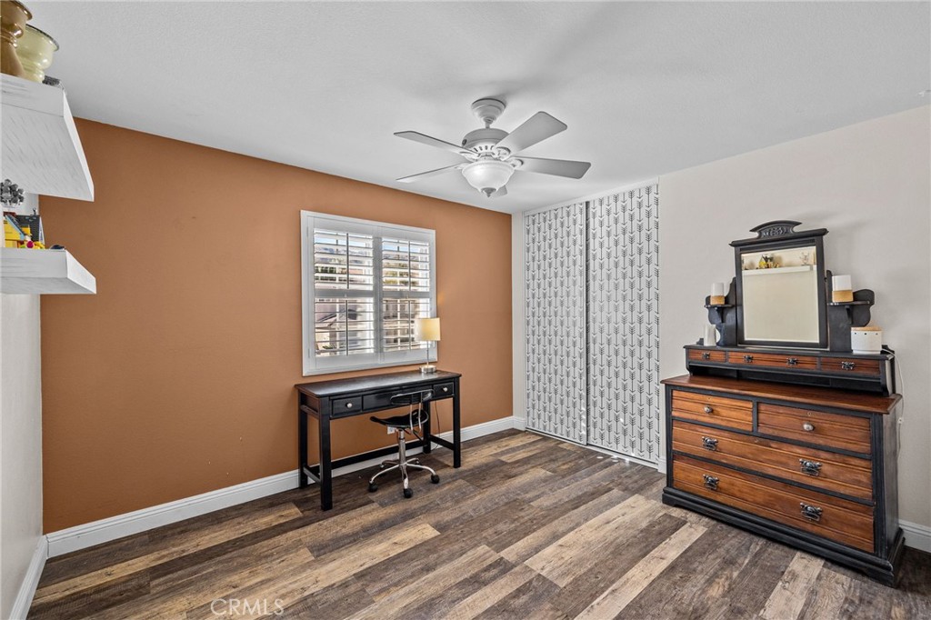 8992 Dahlia Drive Corona, CA 92883 - Photo 18 of 38 a view of a workspace with furniture and a window