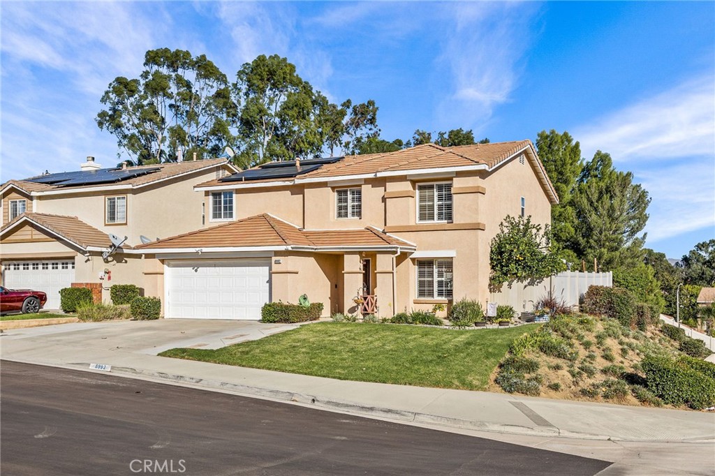 8992 Dahlia Drive Corona, CA 92883 - Photo 2 of 38 front view of a house with a street