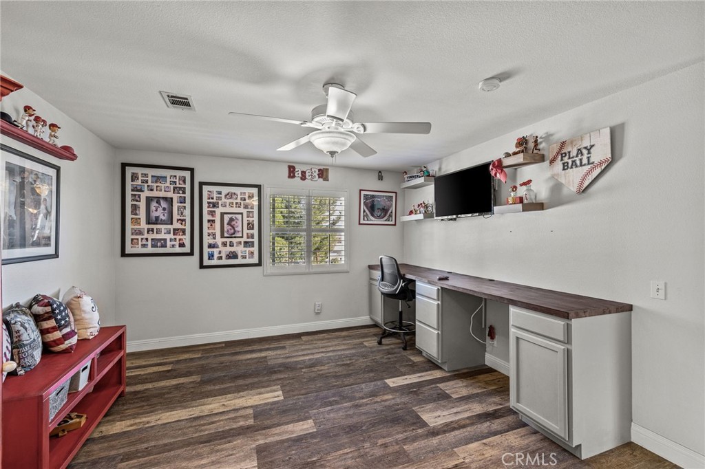 8992 Dahlia Drive Corona, CA 92883 - Photo 22 of 38 a view of a workspace with furniture and a window