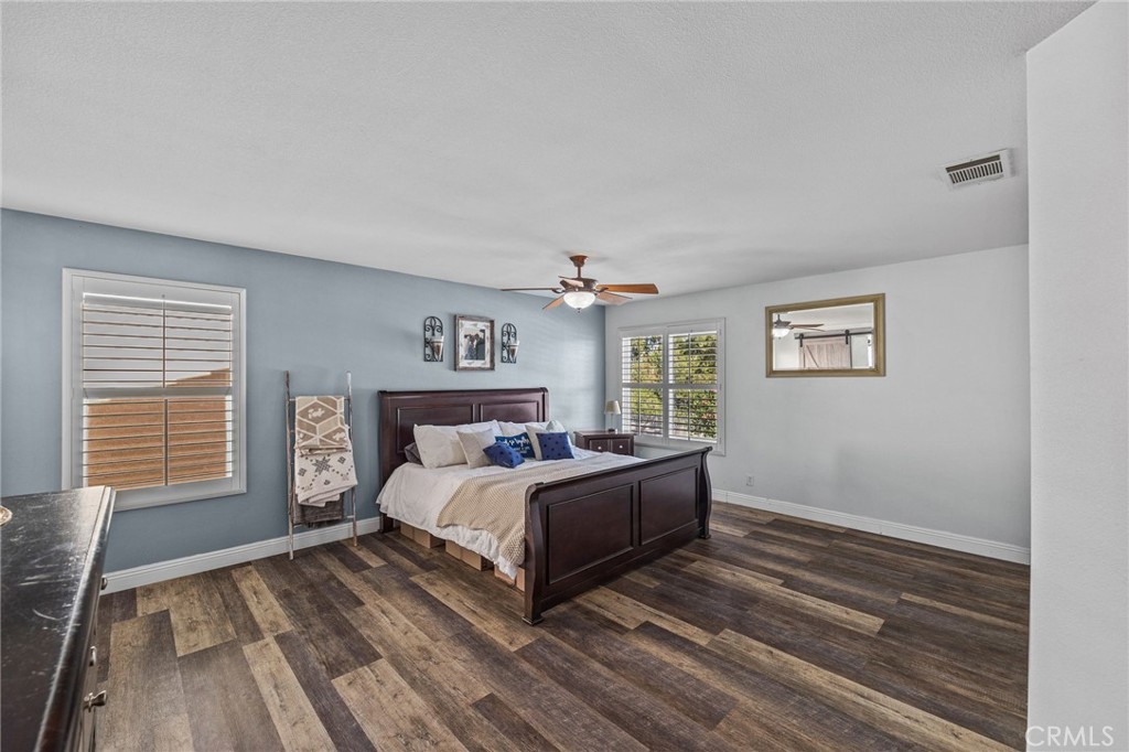 8992 Dahlia Drive Corona, CA 92883 - Photo 25 of 38 a bedroom with a bed and a window