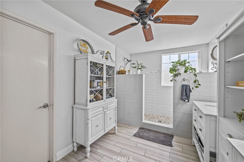 8992 Dahlia Drive Corona, CA 92883 - Photo 30 of 38 a view of a hallway to closet and wooden floor