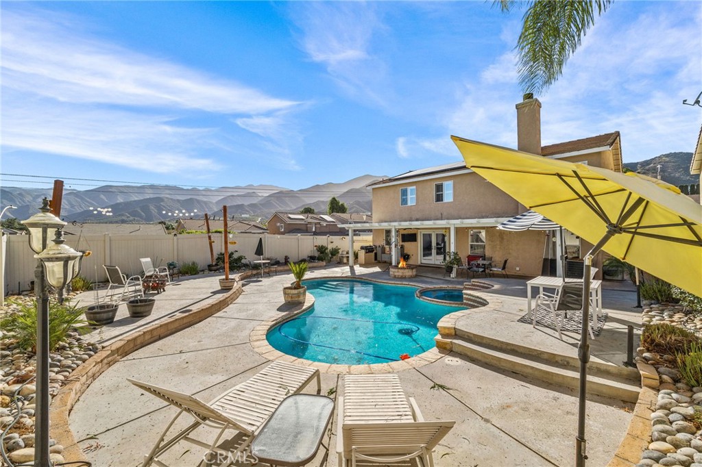 8992 Dahlia Drive Corona, CA 92883 - Photo 33 of 38 a view of a house with pool and chairs