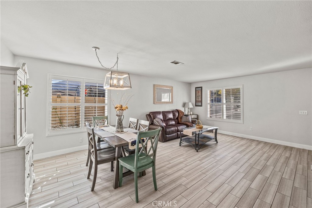 8992 Dahlia Drive Corona, CA 92883 - Photo 5 of 38 a view of a dining room with furniture window and outside view