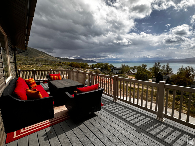 1940 East Shore Road St. Charles, ID 83272 - Photo 57 of 64 Wooden terrace with an outdoor living space and a water view