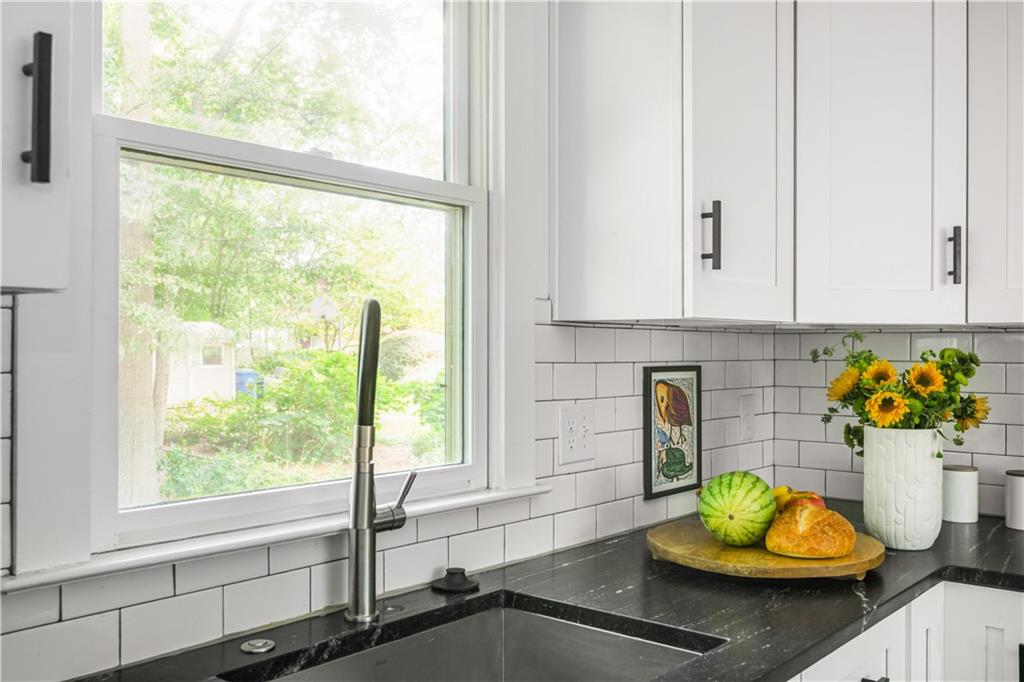 347 Sinclair Avenue Northeast Atlanta, GA 30307 - Photo 14 of 32 a bathroom with a sink and a mirror
