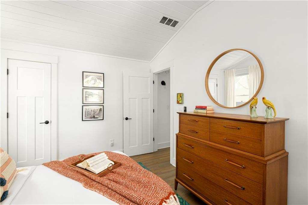 347 Sinclair Avenue Northeast Atlanta, GA 30307 - Photo 16 of 32 a bedroom with a bed and a dresser
