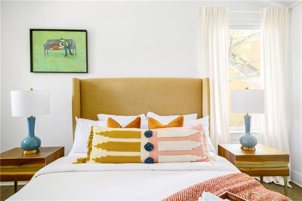 347 Sinclair Avenue Northeast Atlanta, GA 30307 - Photo 17 of 32 a bedroom with a bed and a painting on the wall