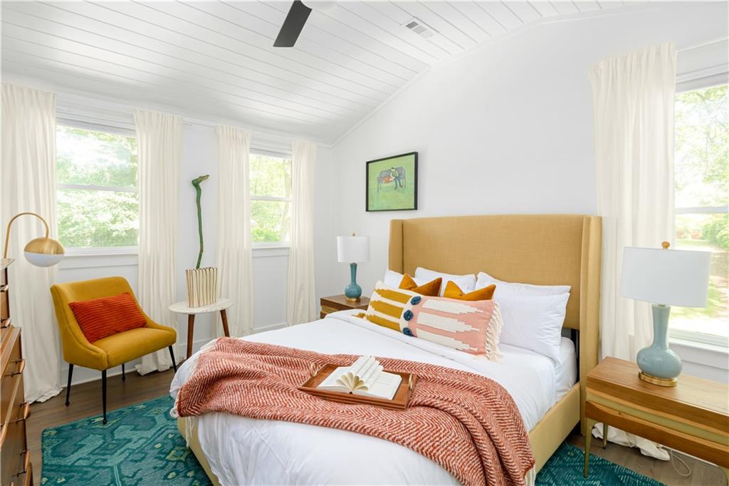 347 Sinclair Avenue Northeast Atlanta, GA 30307 - Photo 2 of 32 a bedroom with a bed chair and window