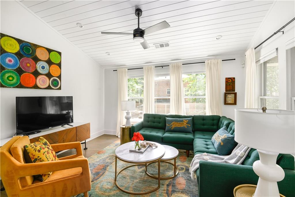 347 Sinclair Avenue Northeast Atlanta, GA 30307 - Photo 6 of 32 a living room with furniture and a flat screen tv