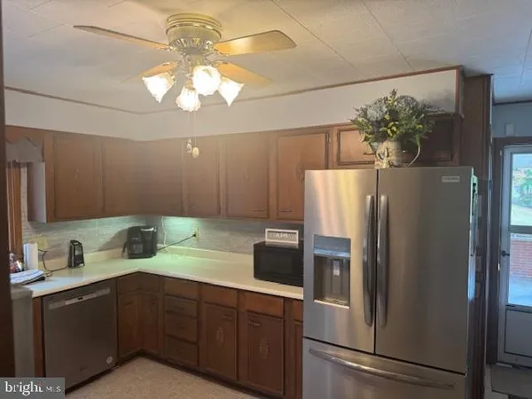 a bathroom with a sink a mirror and a shower