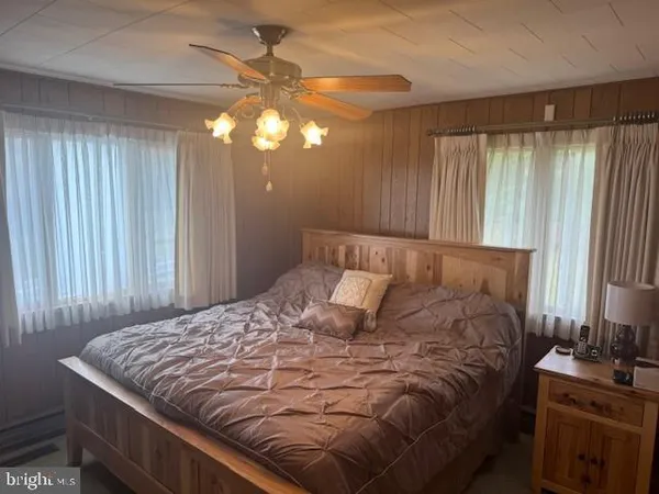 a room with furniture and a wooden floor