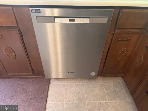 a kitchen with a refrigerator a sink and a stove