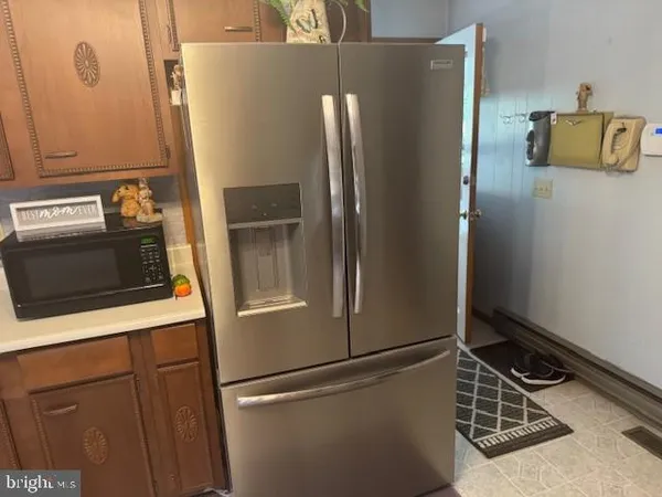 a house that has a tree in front of it