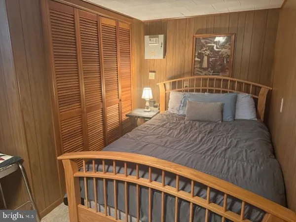 a view of a field with mountains in the background