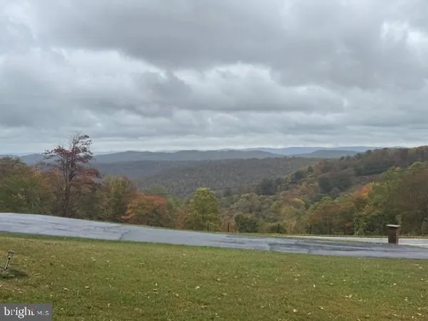 a view of a lake with green space