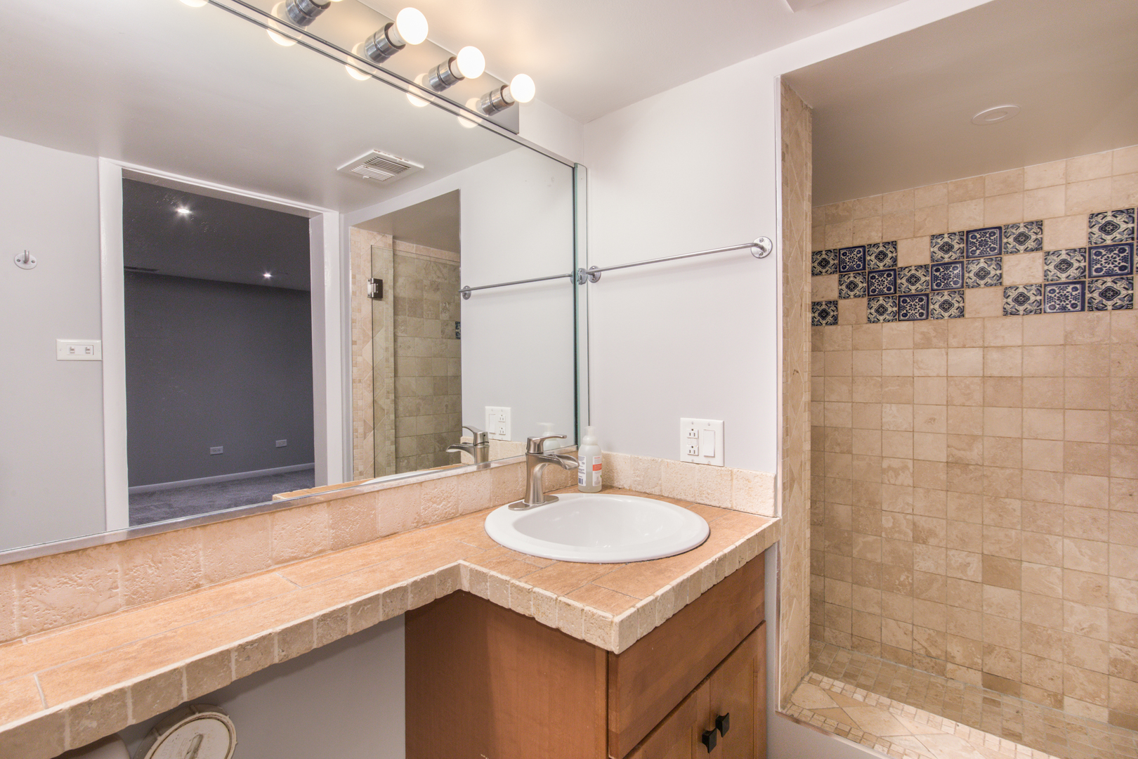 648 West Belden Avenue, Unit B Chicago, IL 60614 - Photo 11 of 24 a bathroom with a sink and a mirror