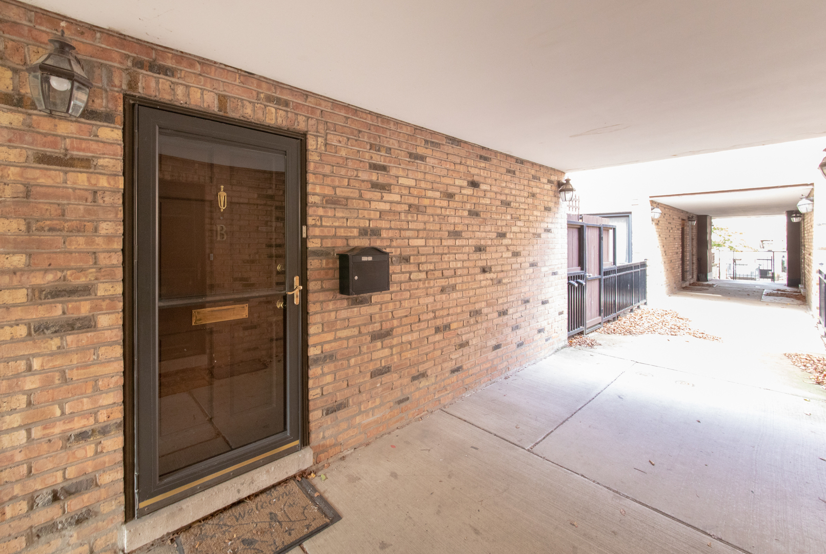 648 West Belden Avenue, Unit B Chicago, IL 60614 - Photo 21 of 24 front view of a brick house with a outdoor space