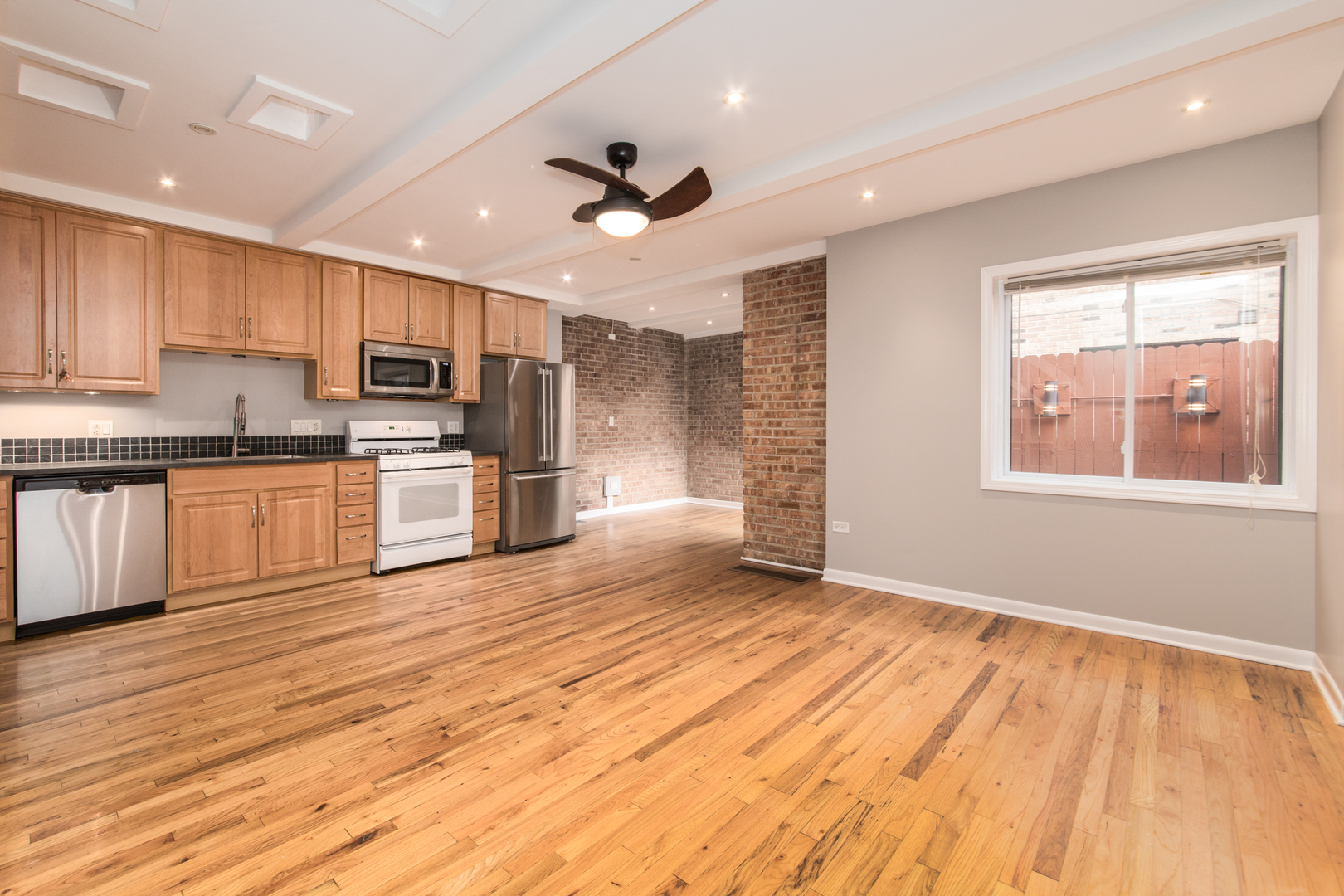 648 West Belden Avenue, Unit B Chicago, IL 60614 - Photo 4 of 24 a view of kitchen with sink microwave and cabinets