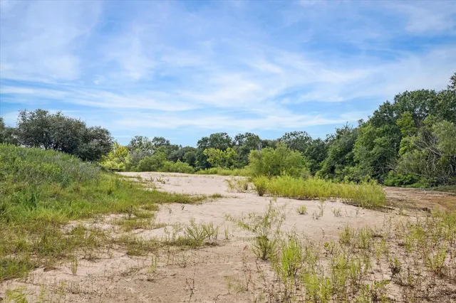 a view of a lake from a yard